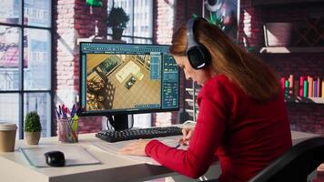 Female employee creates 3D render of an apartment interior using blueprints and architectural software. Employs computer aided tools and models to allow customization of flooring. Camera B. video