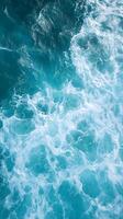 A view of the ocean from above with waves photo
