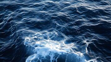 The surface of the ocean is covered with waves photo