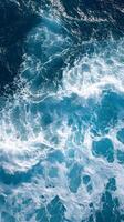 A view of the ocean from above with waves photo