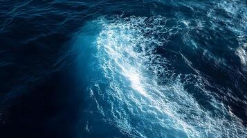 An aerial view of a large wave in the ocean photo