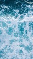 A view of the ocean with waves and foam photo