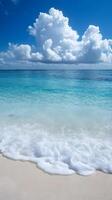 A beach with waves and clouds photo
