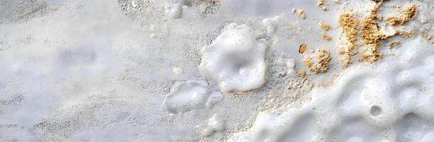 A close up of a white wall with some paint on it photo