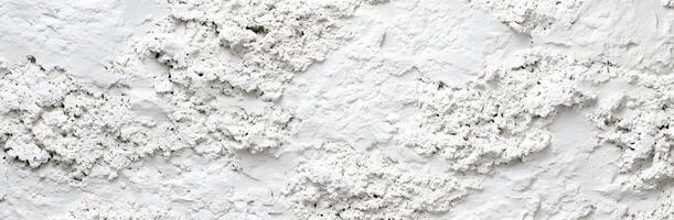 A close up of a white wall with paint photo