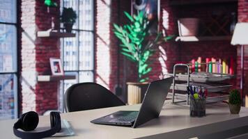 Elegant modern loft apartment featuring a minimalist empty desk. Bright spacious and chic, luxurious home office combines stylish furniture and open design for a sophisticated serene ambiance. video