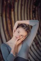 Attractive woman dancing ballet in neglected tunnel photo