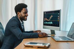 Black man working with binary option photo