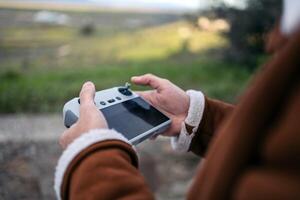 Unrecognizable man controlling a drone photo