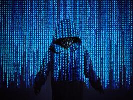 Programmer boy standing in blue code photo