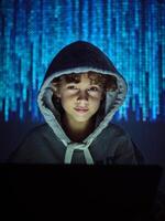 Hacker with laptop on binary code background photo