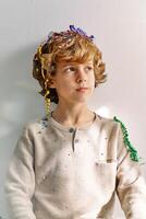 Dreamy schoolboy with confetti of firecracker photo