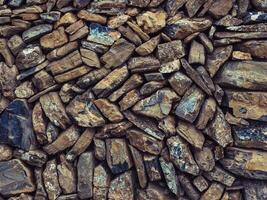 Heap of stones placed in stack for storage photo