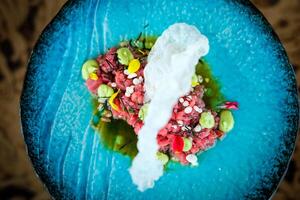 Sophisticated tuna tartare with prawn cracker photo