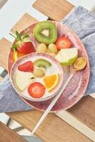 Mix of fruits and berries with yogurt photo