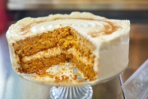 Sliced cake placed on glassware on table photo