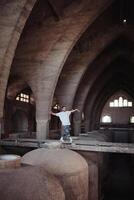 B boy dancing on overpass in abandoned building photo