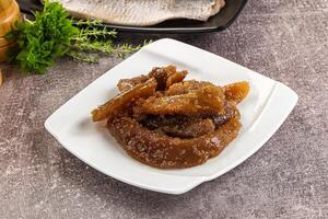 A plate of food with some meat and some vegetables photo