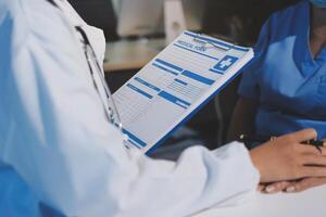 A doctor is talking to a patient photo