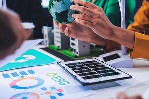 Business people working on a project with a globe photo