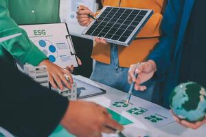 People working on a project with a solar panel photo