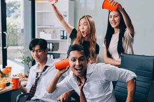 Group of young people having fun at office photo