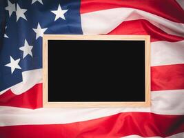 Top view of a mini chalkboard over the American flag background. Space for text. photo