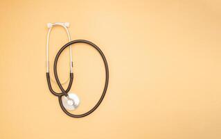 Top view of a stethoscope on an orange background photo