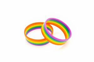 Top view of rainbow patterned wristbands is on a white background photo