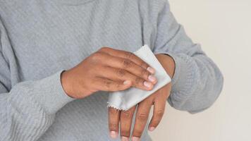 Cleaning hands with a cloth for hygiene in a home setting video