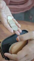 Counting coins at a cafe in the afternoon video