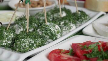 Fresh and vibrant food display with herbs, vegetables, and cheeses video
