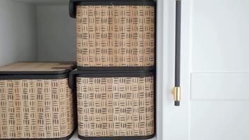 Organizing storage baskets in a modern home setup video