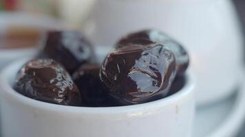 Delicious dates served in a bowl at a local market video