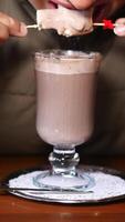 Indulging in a creamy chocolate drink with marshmallows video