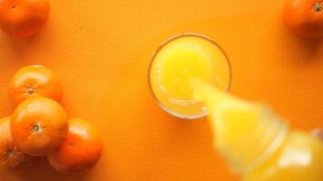 Freshly squeezed citrus juice from ripe mandarins video