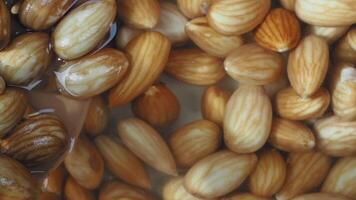Soaking raw almonds for a nutritious snack and meal prep video