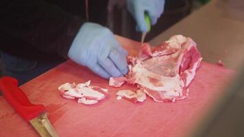 Expert butcher prepares fresh cuts of meat with precision video