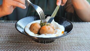 Enjoying delicious dumplings in a cozy dining setting video