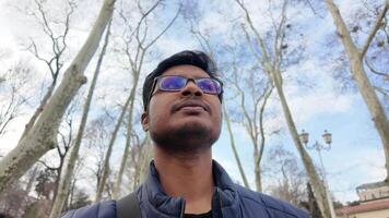 Exploring the serene park under a cloudy sky in winter video