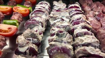 Grilled meat and vegetable skewers prepared for a summer barbecue video