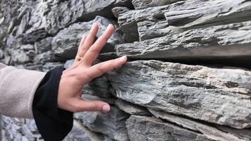 Touching ancient stone walls in a historical location video
