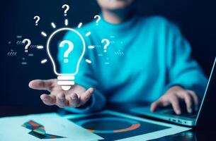 thinking and creative concept,Close up the light bulb and woman working on the desk, Creativity, and innovation are keys to success, new idea and innovation with Brain and light bulbs,big data photo