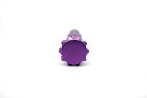 A purple plastic toy with a purple head photo