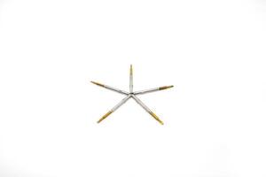 A star shaped object with four needles on it photo