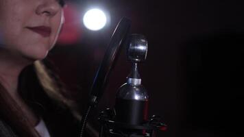 Singer recording song with professional microphone in music studio video