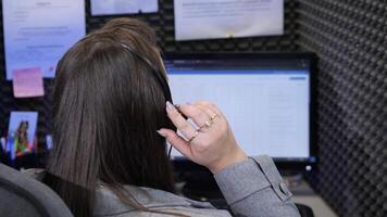 Call center operator working on computer with headset video