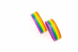 Close-up of a rainbow patterned wristbands are on a white background. Space for text. photo
