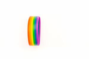 Rainbow patterned wristband on a white background. Top view. Space for text. photo