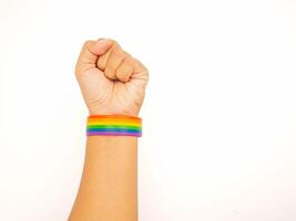 Top view of rainbow wristband in the wrist on a white background photo